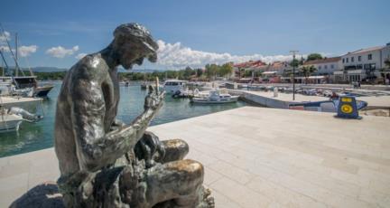 6. Relax on the beach of the fisherman village Njivice and try some amazing sea food